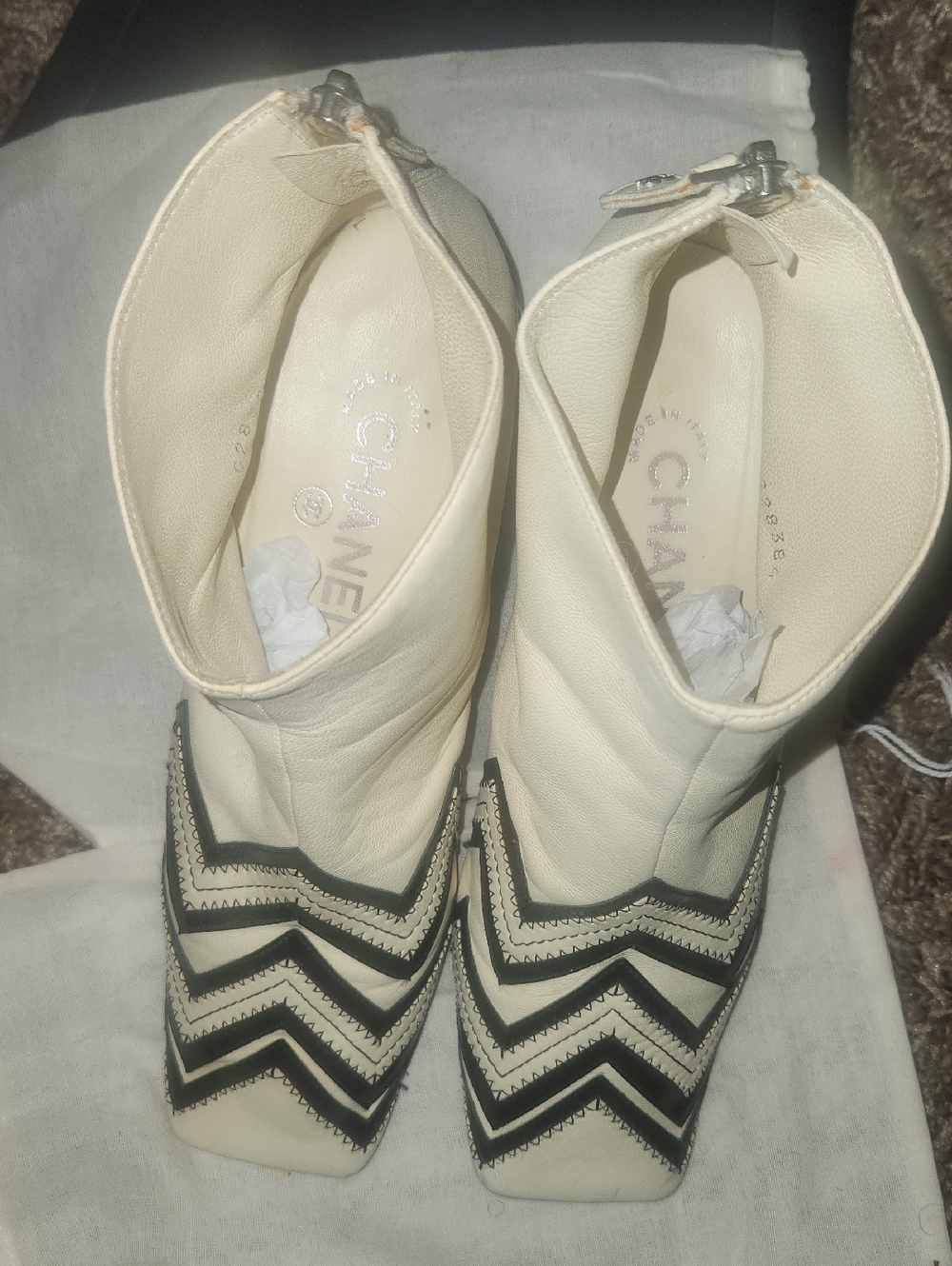 CHANEL Ivory Leather Ankle Boots with Black Chevron Accents